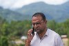 Rajendra Dawadi, a school teacher of Tribhuvan Trishuli Secondary School, talks on his mobile phone in Trishuli Valley in Nepal's Nuwakot district, Monday, Aug. 31, 2026. (AP Photo/Rajesh Kumar Singh)