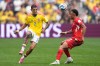 FILE - Colombia's Daniel Muñoz, left, passes the ball past Switzerland's Dan Ndoye during the World Cup round of 16 soccer match between Switzerland and Colombia in Vancouver, British Columbia, Tuesday, July 7, 2026. (AP Photo/Lindsey Wasson, File)