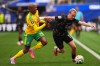South Africa's Khuliso Mudau (20) and Canada's Liam Millar (11) fight for the ball during the World Cup round of 32 soccer match between South Africa and Canada in Inglewood, Calif., near Los Angeles, Sunday, June 28, 2026. (AP Photo/Manu Fernandez)