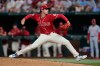 Texas Rangers pitcher Cole Winn throws to the Los Angeles Angels in the seventh inning of a baseball game Friday, Aug. 21, 2026, in Arlington, Texas. (AP Photo/Tony Gutierrez)