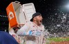 Boston Red Sox's Trevor Story is doused with a cooler of ice water after his game-winning, RBI single in the bottom ninth inning of a baseball game against the Seattle Mariners, Monday, Aug. 31, 2026, in Boston. (AP Photo/Charles Krupa)