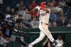 Washington Nationals' Daylen Lile watches his two run home run go over the right field fence during the seventh inning of a baseball game against the Miami Marlins, Monday, Aug. 31, 2026, in Washington. (AP Photo/John McDonnell)