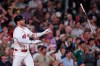 Boston Red Sox's Trevor Story flips his bat after hitting the winning RBI single in the bottom 10th inning of a baseball game against the Seattle Mariners, Monday, Aug. 31, 2026, in Boston. (AP Photo/Charles Krupa)