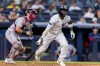 New York Yankees' Jazz Chisholm Jr., right, watches after he hit into a fielder's choice in the eighth inning during the second baseball game of a doubleheader against the Boston Red Sox, Saturday, Aug. 29, 2026, in New York. (AP Photo/Corey Sipkin)
