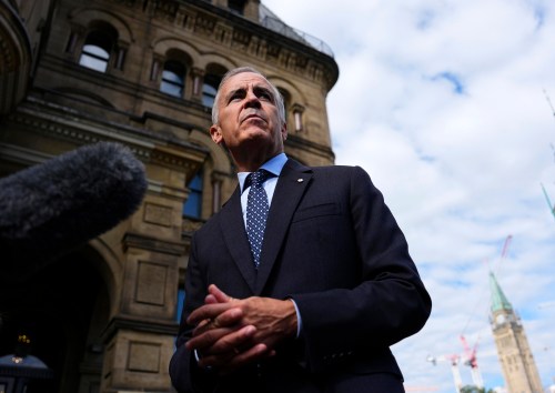 Prime Minister Mark Carney speaks with members of the media as he arrives at the Office of the Prime Minister and Privy Council in Ottawa on Tuesday, Sept. 1, 2026. THE CANADIAN PRESS/Justin Tang