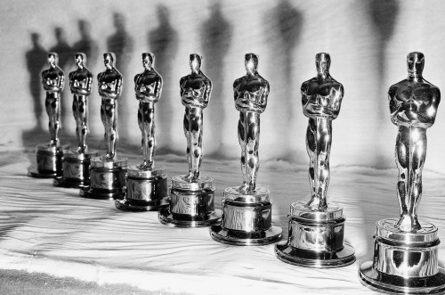 FILE - Oscar statuettes stand in a row, ready for the the presentation of the 22nd annual Academy Awards, in Los Angeles, March 9, 1950. (AP Photo, File)