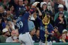 Seattle Mariners designated hitter Lazaro Montes (99) and outfielder Julio Rodríguez (44) celebrate Montes' home run during the fifth inning of a baseball game against the Boston Red Sox, Tuesday, Sept. 1, 2026, in Boston. (AP Photo/Mark Stockwell)