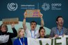 FILE - Activists participate in a demonstration for phasing out fossil fuels at the COP29 U.N. Climate Summit, Nov. 19, 2024, in Baku, Azerbaijan. (AP Photo/Sergei Grits, File)