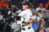 Colorado Rockies' TJ Rumfield gestures as he crosses home plate after hitting a two-run home run off Baltimore Orioles relief pitcher Luis De Leon in the seventh inning of a baseball game Tuesday, Sept. 1, 2026, in Denver. (AP Photo/David Zalubowski)