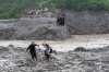Residents pull a newly installed zipline to help people commute across the Trishuli river in the aftermath of flash floods at Bidur in Nepal's Nuwakot district, Nepal, Wednesday, Sept. 2, 2026. (AP Photo/Rajesh Kumar Singh)
