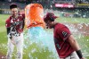 Arizona Diamondbacks' James McCann (8) gets doused in Gatorade by Diamondbacks' Jordan Lawlar (10) in celebration of McCann's eighth inning home run against the Philadelphia Phillies after a baseball game, Wednesday, Sept. 2, 2026, in Phoenix. (AP Photo/Ross D. Franklin)