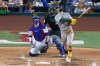 Athletics' Henry Bolte, right, watches his two-run home run as Texas Rangers catcher Danny Jansen, left, and home plate umpire Nic Lentz, center, look on during the fourth inning of a baseball game Wednesday, Sept. 2, 2026, in Arlington, Texas. (AP Photo/Julio Cortez)