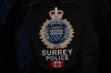 A Surrey Police patch is worn by an officer at RCMP 