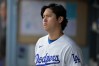 Los Angeles Dodgers' Shohei Ohtani looks on from the dugout during the first inning of a baseball game against the St. Louis Cardinals, Tuesday, Sept. 1, 2026, in Los Angeles. (AP Photo/Jayne Kamin-Oncea)