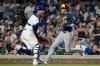 Milwaukee Brewers' Christian Yelich, right, scores on a one-run single by Cooper Pratt as Chicago Cubs catcher Miguel Amaya waits for the ball during the seventh inning of a baseball game in Chicago, Wednesday, Sept. 2, 2026. (AP Photo/Nam Y. Huh)