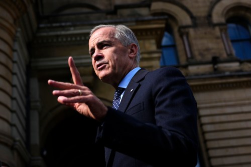 Prime Minister Mark Carney speaks with members of the media as he arrives at the Office of the Prime Minister and Privy Council in Ottawa, on Tuesday, Sept. 1, 2026. THE CANADIAN PRESS/Justin Tang