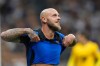 Inter Milan's Federico Dimarco celebrates at the end of a Serie A soccer match between Inter Milan and Monza, in Milan, Italy, Saturday, Aug. 22, 2026. (AP Photo/Luca Bruno)