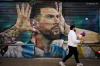 A man walks past by a mural of Argentina soccer player Lionel Messi in Buenos Aires, Argentina, Monday, Aug. 31, 2026. (AP Photo/Natacha Pisarenko)