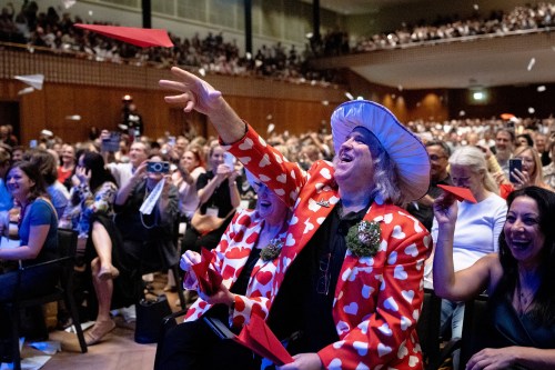 Spectators throw paper planes during the Ig Nobel Prize ceremony held in the Zurich Convention Center in Zurich, Switzerland, on Thursday, Sept. 3, 2026. (Claudio Thoma/Keystone via AP)