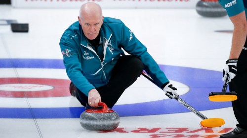 Team Wild Card Three skip Glenn Howard makes a shot  as he plays Team Yukon at the Brier in Calgary, Alta., Sunday, March 7, 2021.THE CANADIAN PRESS/Jeff McIntosh