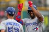 Toronto Blue Jays' Jesús Sánchez gestures from first base after hitting a single in the fifth inning of a baseball game against the Cleveland Guardians in Cleveland, Thursday, Sept. 3, 2026. (AP Photo/Sue Ogrocki)