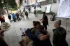 Old growth supporters play music and share stories as they gather at the Victoria Courthouse to lend their support for the 10 land defenders who stood in front of industry to try and protect the forest in the Walbran Valley ahead of their hearing in Victoria, on Monday, May 25, 2026. THE CANADIAN PRESS/Chad Hipolito