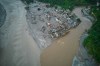A drone view shows houses damaged by flash floods surrounded by sludge, mud and debris along the swollen Trishuli River in Devighat, Nepal, Thursday, Sept. 3, 2026. (AP Photo/Rajesh Kumar Singh)