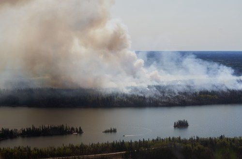 A wildfire burns in northern Manitoba near Flin Flon on Tuesday, May 14, 2024. THE CANADIAN PRESS/David Lipnowski