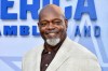 FILE - Emmitt Smith arrives at the premiere of 