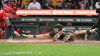 Los Angeles Angels catcher Moises Ballseteros, eft, tries unsuccessfully to tag out Pittsburgh Pirates' Konnor Griffin, right, during the second inning of a baseball game Friday, Sept. 4, 2026, in Pittsburgh. (AP Photo/Philip G. Pavely)