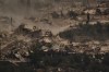 FILE - An Israeli tank moves past a convoy of the United Nations peacekeeping forces in Lebanon (UNIFIL) in southern Lebanon, as seen from northern Israel on June 26, 2026. (AP Photo/Leo Correa, File)