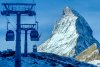 Gondolas go up next to the Matterhorn in Zermatt, Switzerland, Thursday, Dec.3, 2020. (AP Photo/Jamey Keaten)