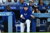 Los Angeles Dodgers' Shohei Ohtani, center, looks on during the eighth inning of a baseball game against the Washington Nationals, Friday, Sept. 4, 2026, in Los Angeles. (AP Photo/William Liang)