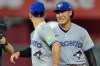 Toronto Blue Jays' Andres Gimenez, left, and Kazuma Okamoto celebrate after their baseball game against the Kansas City Royals, Saturday, Sept. 5, 2026, in Kansas City, Mo. (AP Photo/Charlie Riedel)
