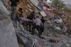 People carry a body of a person who was killed at a house that was hit by an Israeli airstrike in Arab Salim village, southern Lebanon, Sunday, Sept. 6, 2026. (AP Photo/Mohammed Zaatari)