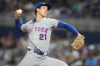 FILE - New York Mets relief pitcher Jonah Tong (21) throws during the seventh inning of a baseball game against the Miami Marlins, May 22, 2026, in Miami. (AP Photo/Lynne Sladky, File)