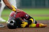 Arizona Diamondbacks' Geraldo Perdomo (2) holds his head after being hit by a line drive by Ketel Marte during the third inning of a baseball game against the Houston Astros Sunday, Sept. 6, 2026, in Houston. (AP Photo/David J. Phillip)