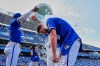 Kansas City Royals' Vinnie Pasquantino (9) is doused by teammates after their baseball game against the Toronto Blue Jays, Sunday, Sept. 6, 2026, in Kansas City, Mo. (AP Photo/Charlie Riedel)