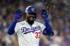 Los Angeles Dodgers' Teoscar Hernández has seeds thrown at him after hitting a three-run home run during the sixth inning of a baseball game against the Cincinnati Reds, Monday, Sept. 7, 2026, in Los Angeles. (AP Photo/Mark J. Terrill)