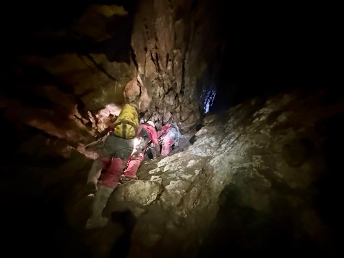 Search and Rescue Alberta and Alberta/BC Cave Rescue members along with Canmore Fire Rescue prepare to rescue a caver trapped in Rat's Nest Cave, in Canmore, Alta., in this Aug. 15, 2026 handout photo. THE CANADIAN PRESS/Handout - Search and Rescue Alberta (Mandatory Credit)