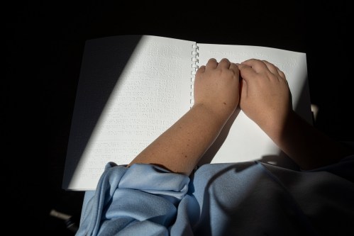 A student reads a book in braille at the Jacques-Ouellette School for students with visual impairments in Longueuil on Tuesday, Sept. 1, 2026. THE CANADIAN PRESS/Christinne Muschi