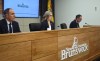 New Brunswick Premier Susan Holt flanked, centre, Indigenous Affairs Minister Keith Chiasson, left, and Natural Resources Minister John Herron address reporters in Fredericton on Wednesday, Aug. 26, 2026.
 THE CANADIAN PRESS/Eli Ridder