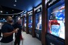 Former Blue Jays player Jose Bautista looks at his display during the opening of the team's new Hall of Excellence at Rogers Centre in Toronto on Aug. 29, 2026. THE CANADIAN PRESS/Jon Blacker