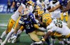 Edmonton Elks defence stops Winnipeg Blue Bombers' Brady Oliveira (20) during second half CFL football action in Winnipeg on Thursday, June 25, 2026. THE CANADIAN PRESS/John Woods