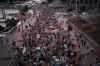 People march during a rally to protest the dismissal of Mykhailo Fedorov as Ukraine's Defense Minister in Kyiv, late Sunday, Aug. 16, 2026. (AP Photo/Francisco Seco)