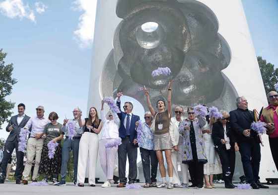 Officials cut a feather boa to mark the official unveiling of Thunderhead, the 2SLGBTQI+ National Monument, in Ottawa on Friday. (Patrick Doyle / The Canadian Press files)