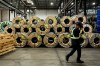 Stainless steel coils wait to be pressed into sheets in Montreal on Thursday, Sept. 18, 2025. THE CANADIAN PRESS/Christopher Katsarov