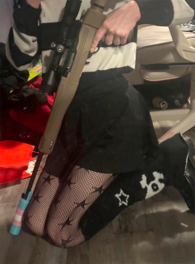 A person alleged to be Jesse Van Rootselaar is seen posing with a weapon in this Feb. 10, 2026, photo that was sent to James Bryant. — THE CANADIAN PRESS/Handout — U.S. Department of Justice (Mandatory Credit)