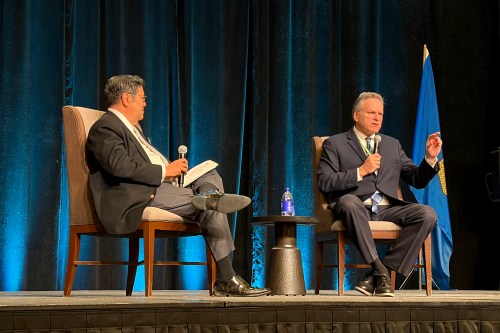 Alaska Gov. Mike Dunleavy, right, speaks on stage as Gary Mar, president and CEO of the Canada West Foundation, looks on during a talk at the Global Business Forum, in Banff, Alta., Friday, Sept. 25, 2026. THE CANADIAN PRESS/Lauren Krugel