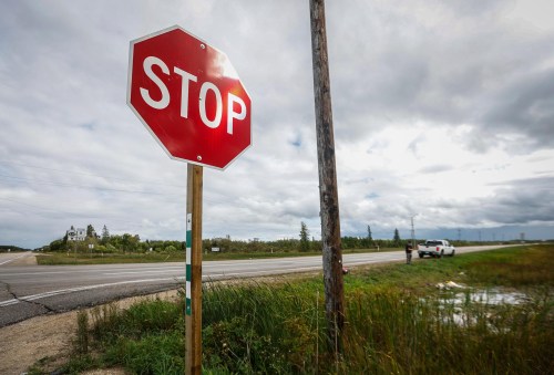 JOHN WOODS / FREE PRESS
A friend of four teens killed in an MVC visits a memorial  placed at the intersection of highways 8 and 229 just west of Winnipeg Beach Tuesday, September 8, 2026. Four teens were killed when the westbound vehicle they were travelling in on 229 was hit by a van travelling south bound on 8.  

reporter: ?
